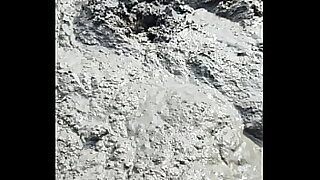 Solo Male Wading Barefoot in Lakebed of Mud
