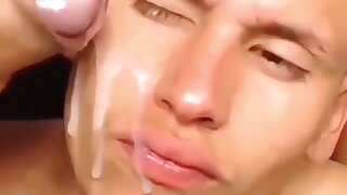 Twink gets a cumshot on his face during a live cam show