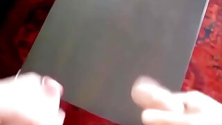 Two dudes jerk off and shoot a bunch of cum on a table.
