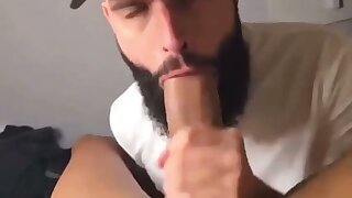 Bearded hunk worships and sucks a thick cock