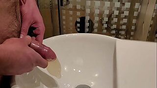 Pissing inside a used condom